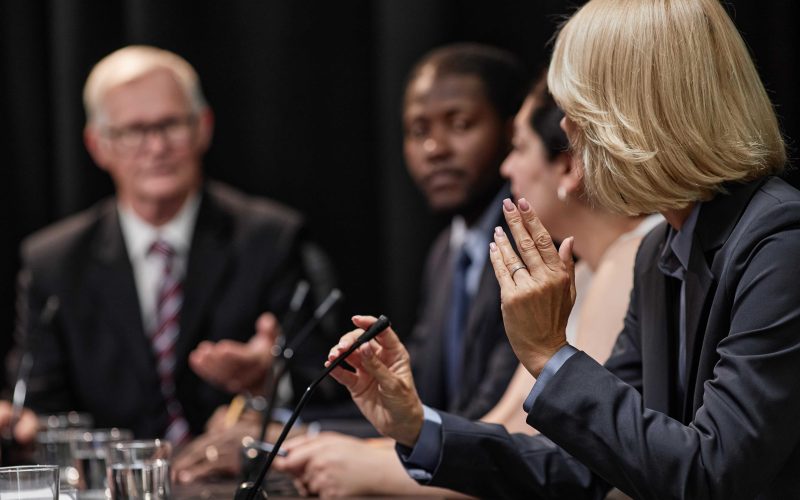 group of people sitting discussing