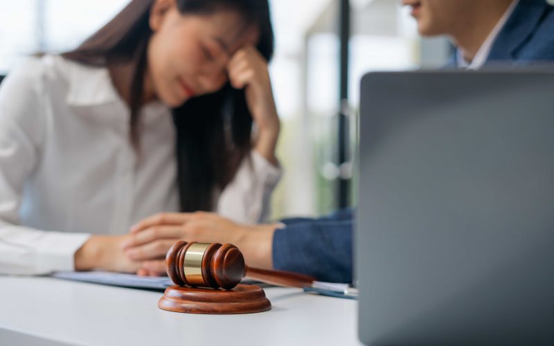 woman ask help from a lawyer for defamation